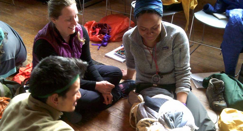 a group of gap year students practice skills during a wilderness first responder course